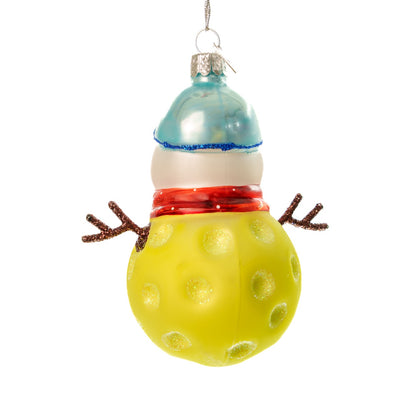 Back of a handmade glass Christmas ornament of a pickleball snowman on a white studio backdrop