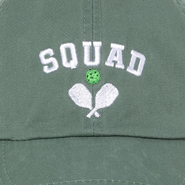 Detailed view of baseball hat that says Squad embroidered on it