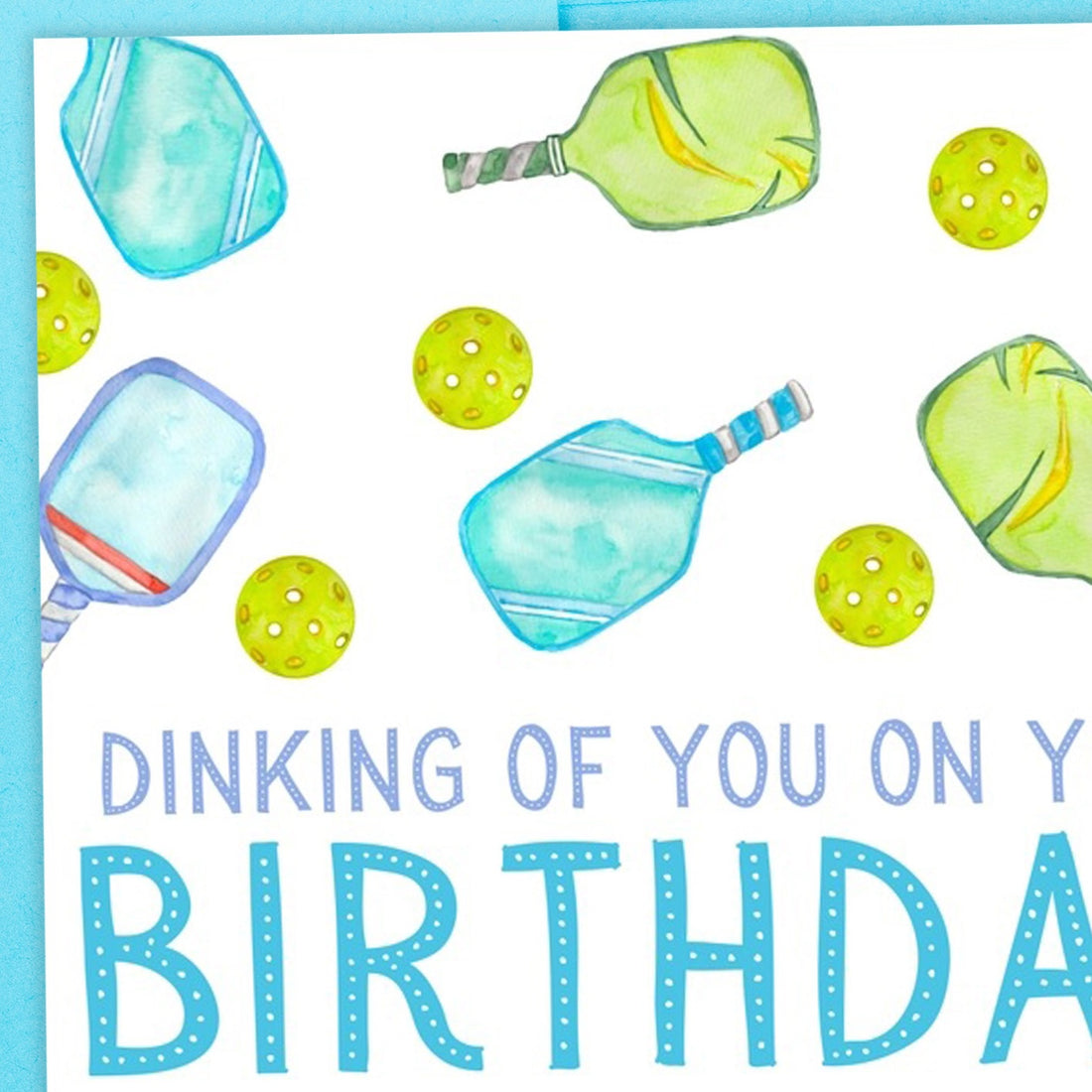 Close up image of a pickleball-themed birthday card that says &quot;Dinking Of You On Your Birthday&quot; Greeting Card