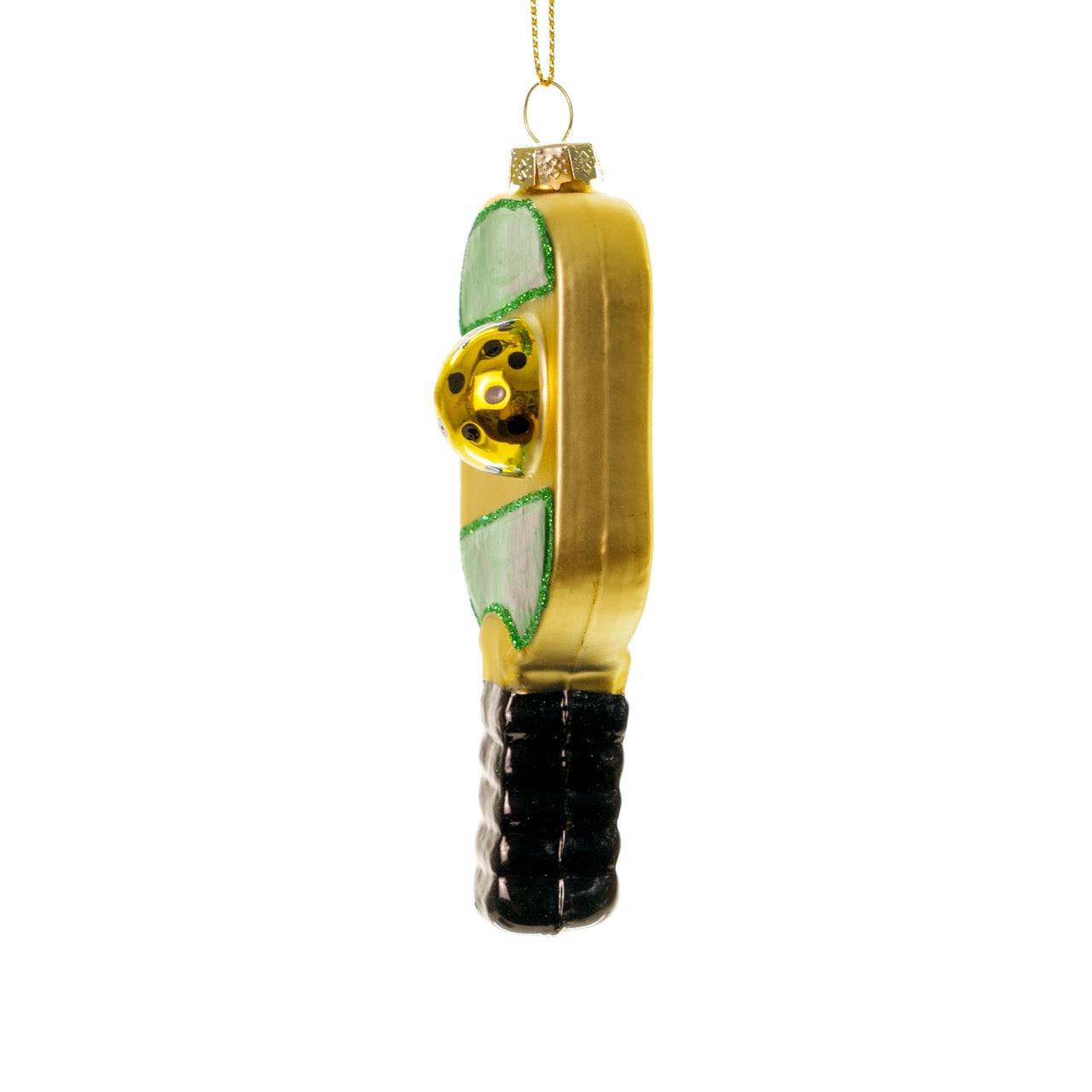 Left side of an elegant handmade glass green and gold pickleball paddle Christmas ornament hanging in front of a white studio backdrop