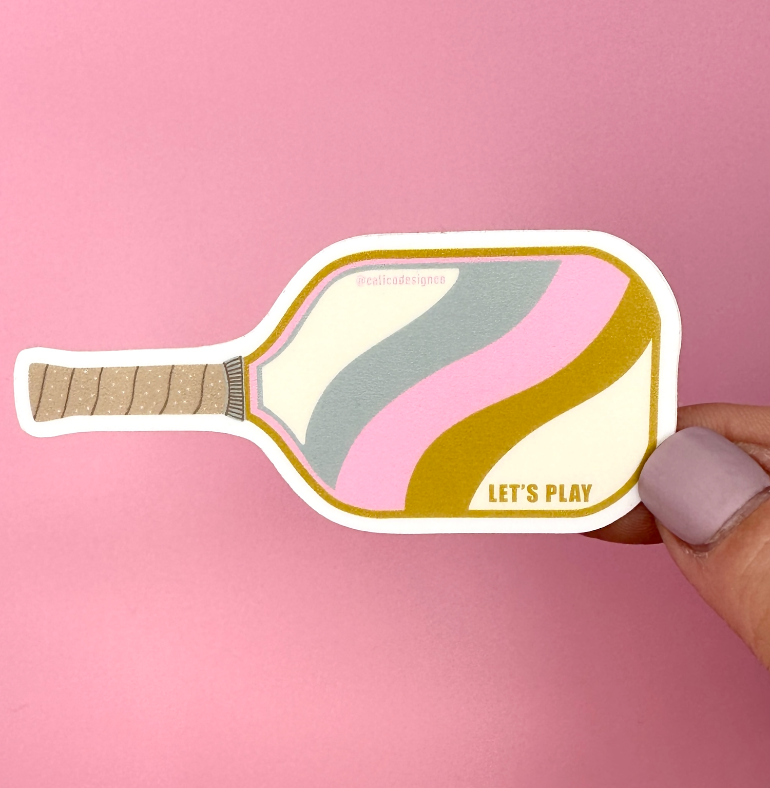 Sticker in the shape of a pickleball paddle that says Let&