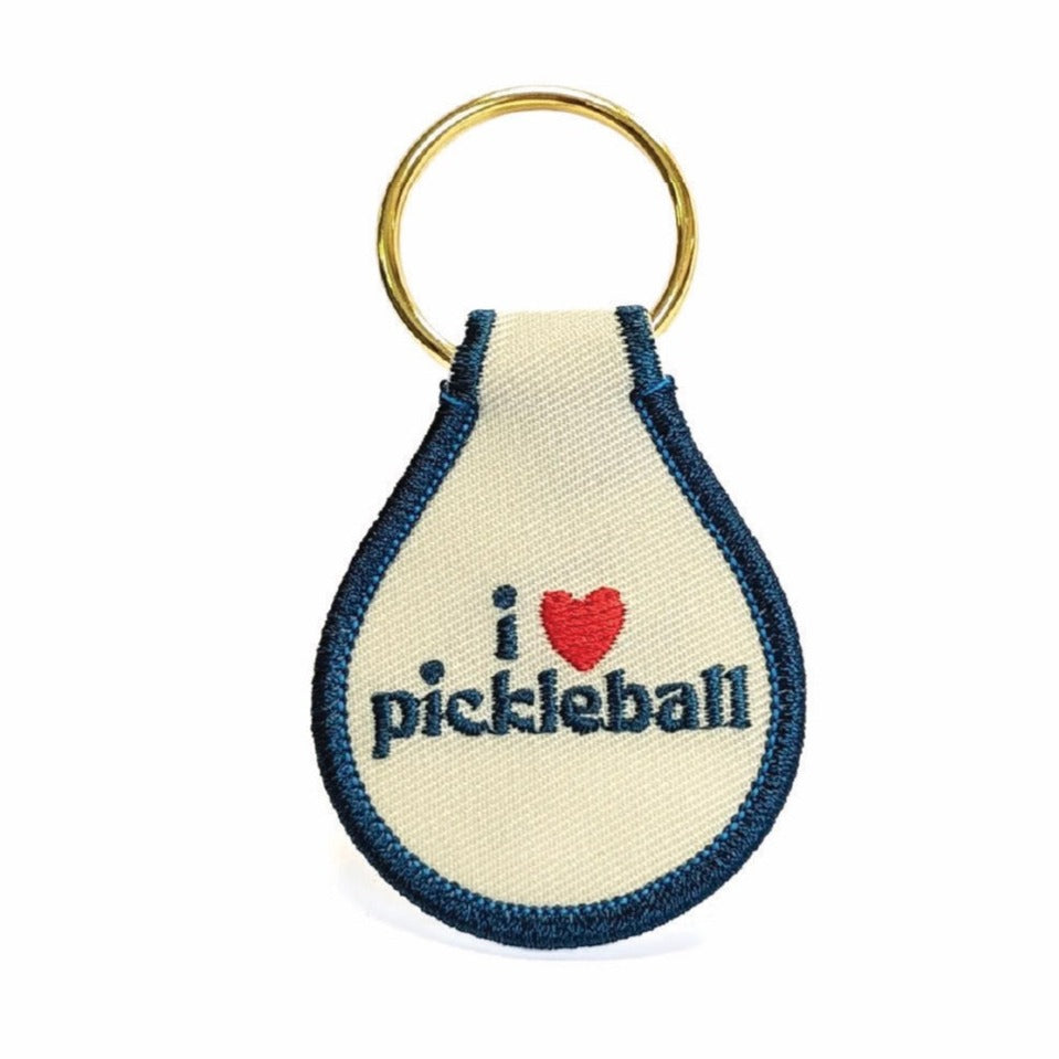 Red white and blue keychain that says &quot;I heart pickleball&quot; on it