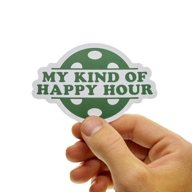 Large green sticker with pickleball that says My Kind of Happy Hour on it being held in hand