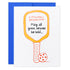 Funny pickleball birthday card with a pickleball paddle and ball that says "A Pickleball Birthday Poem: May all your serves be bold..." laying flat on a white studio backdrop.