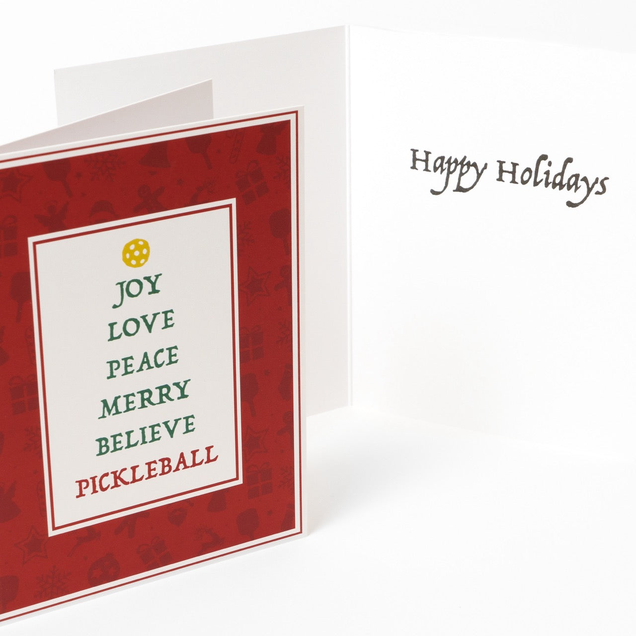 Cover and inside message of a pickleball themed greeting card with festive words stacked like a Christmas tree with a message that says &quot;Happy Holidays&quot;