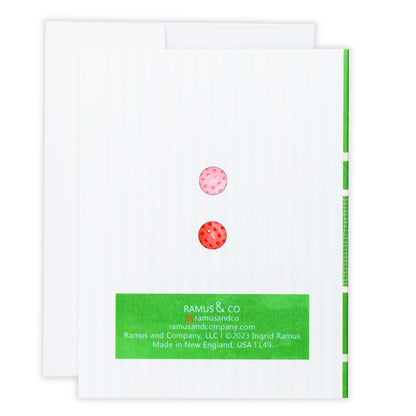 Backside of a pickleball greeting card with two pickleballs.