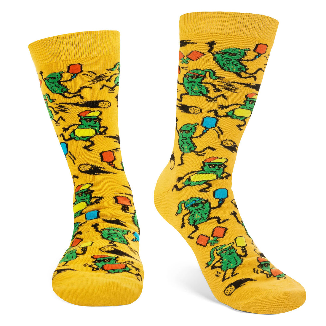 Humorous yellow socks with pickles playing pickleball on them being worn