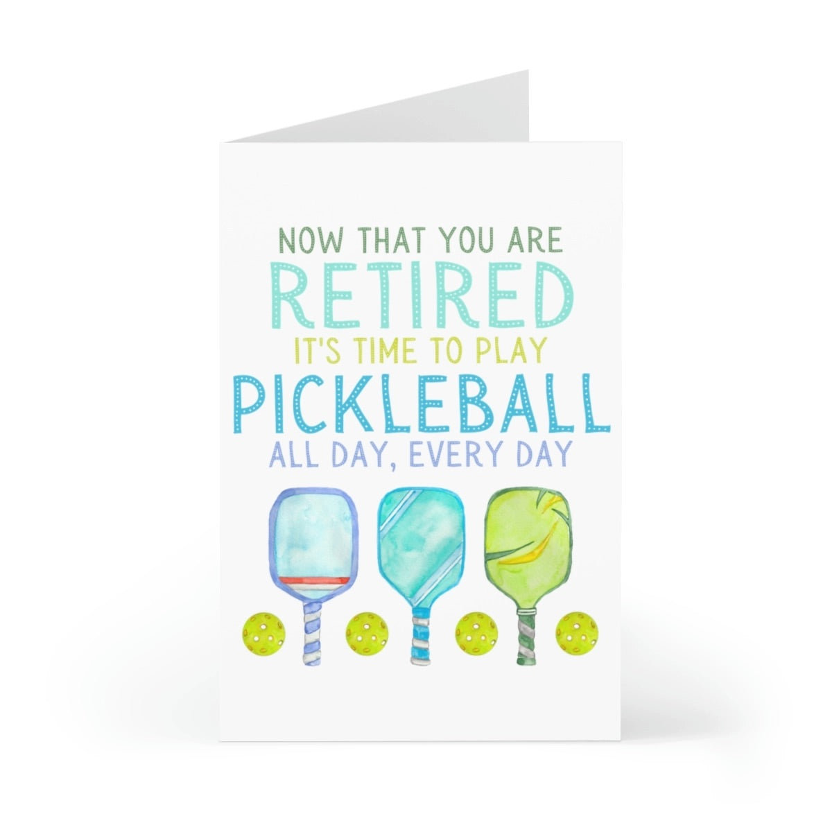 Pickleball-themed retirement card with pickleball paddles and balls on it slightly open