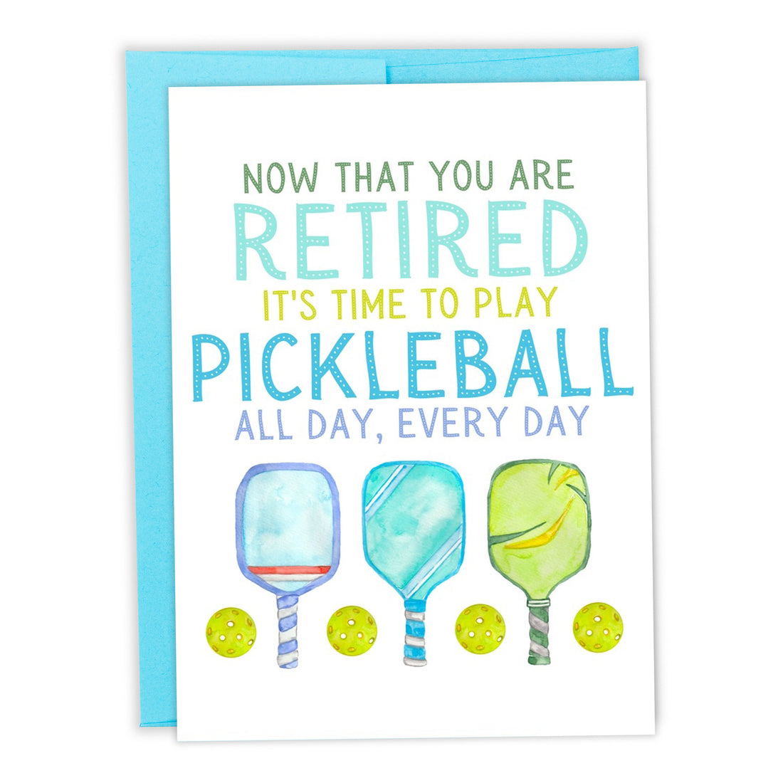 Pickleball-themed retirement card with pickleball paddles and balls on it laying flat