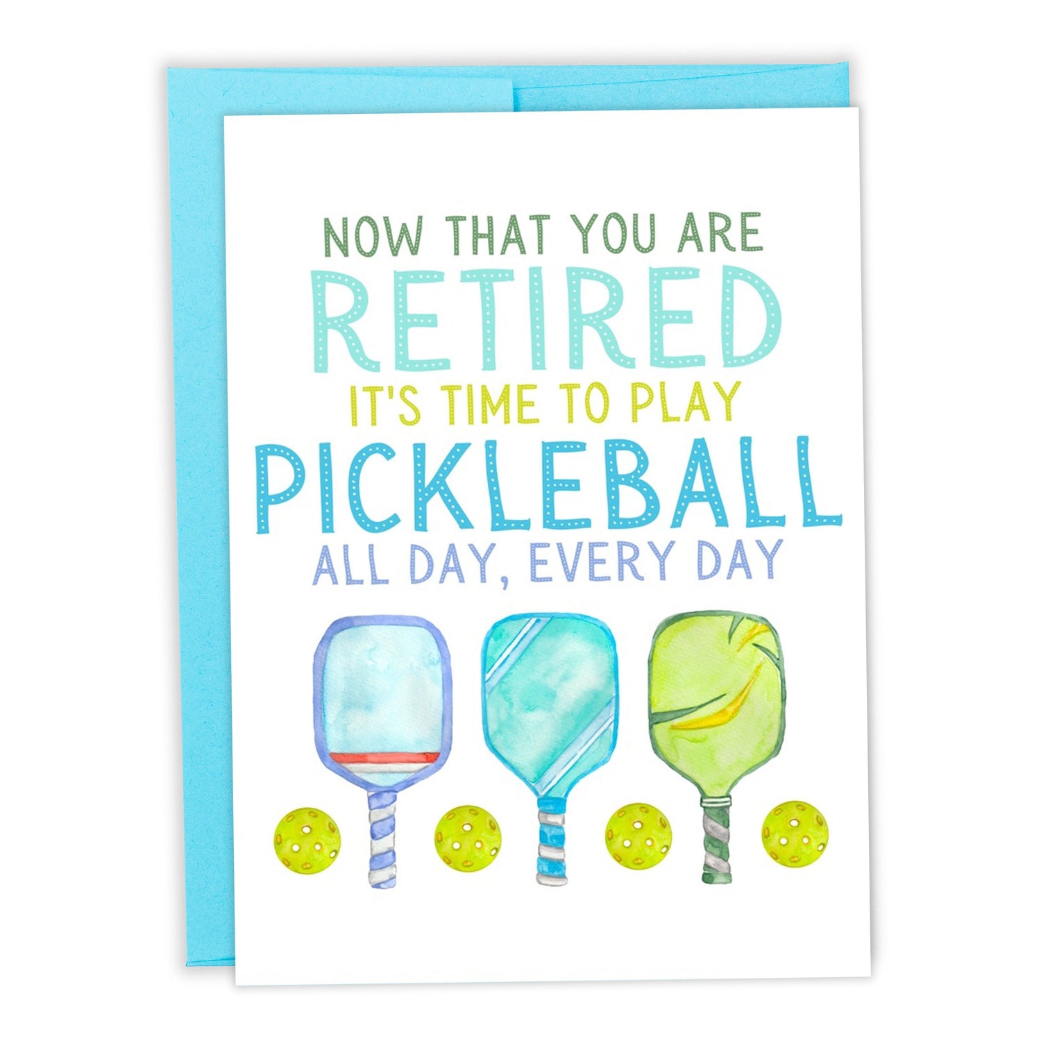 Pickleball-themed retirement card with pickleball paddles and balls on it laying flat