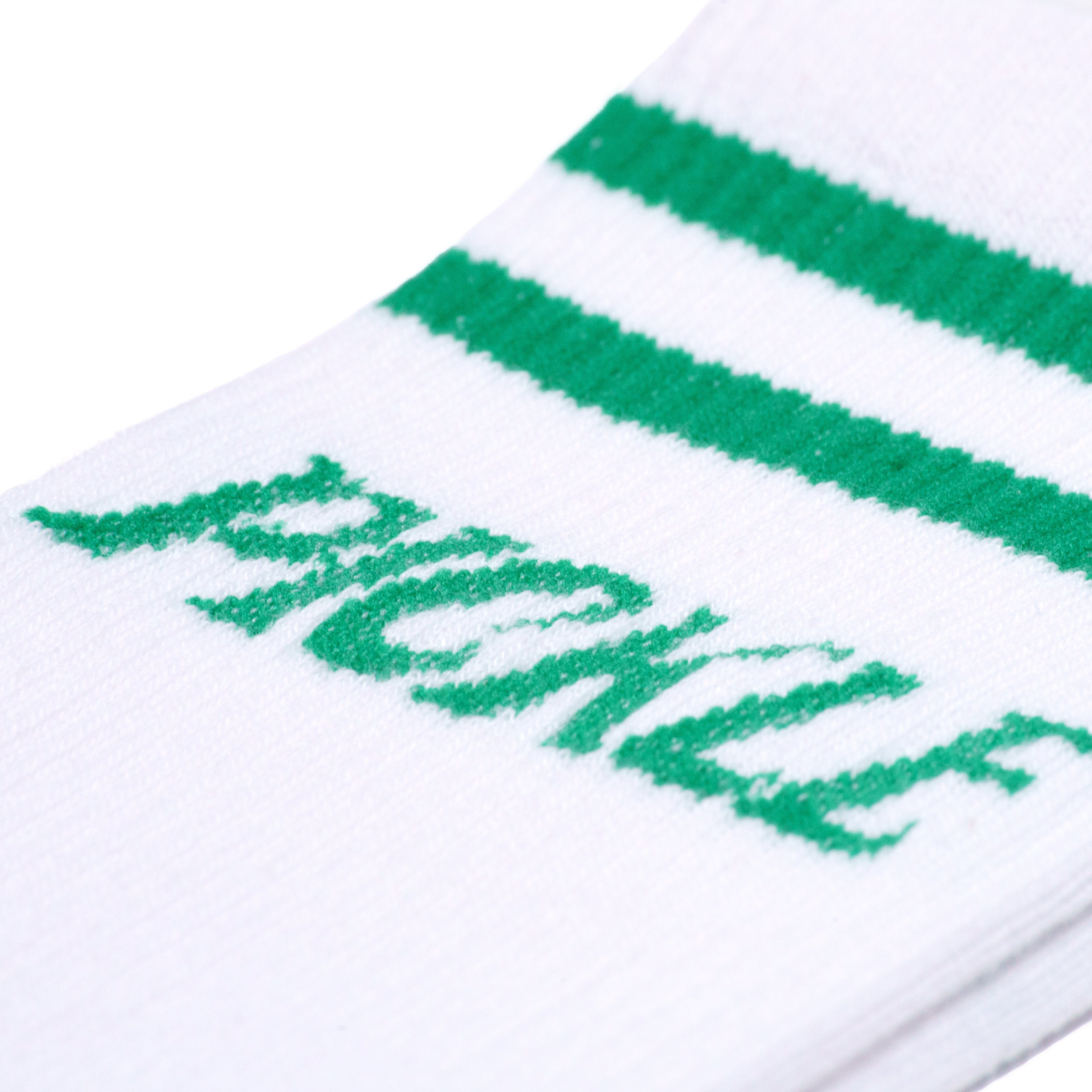 Detailed view of white retro mid calf pickleball socks with green stripes and green text that says &quot;Pickle&quot;.