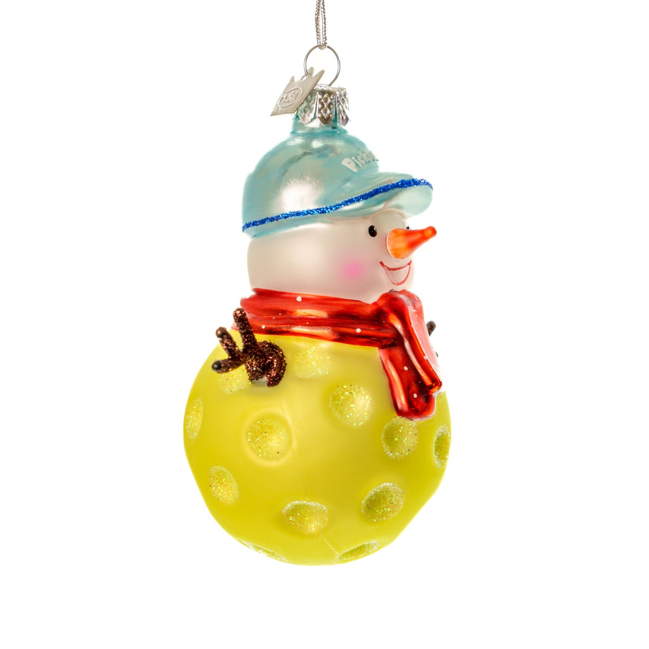 Right side of a handmade glass Christmas ornament of a pickleball snowman on a white studio backdrop