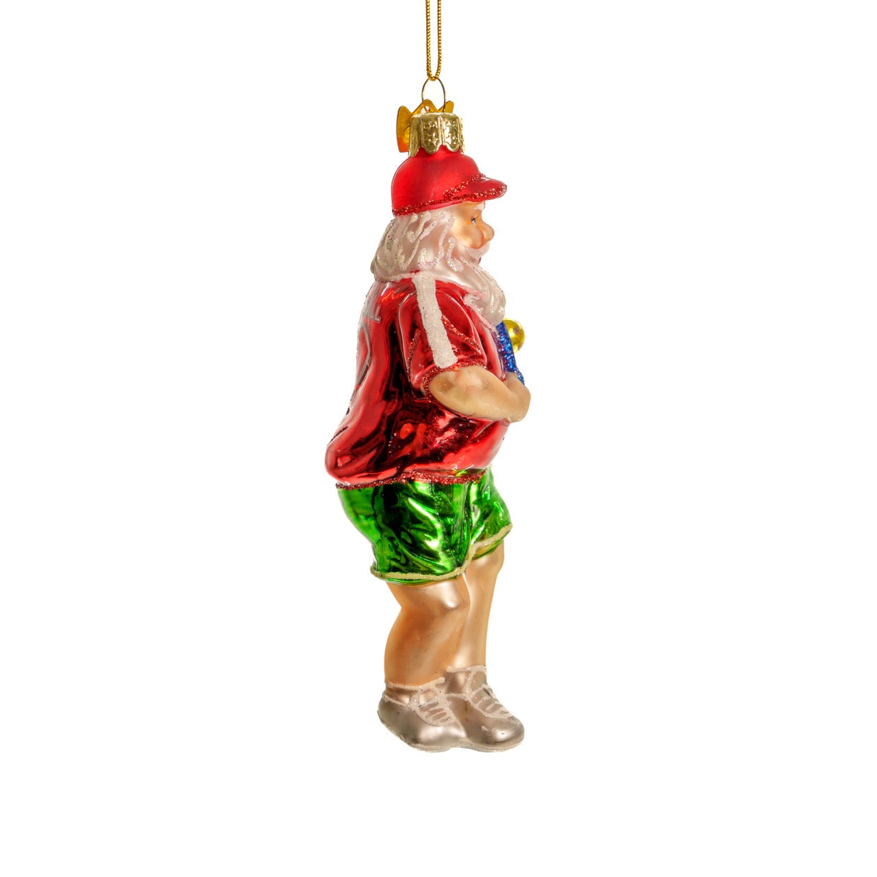 Right side of a classic handmade glass Christmas ornament of Santa playing pickleball  hanging in front of a white studio backdrop