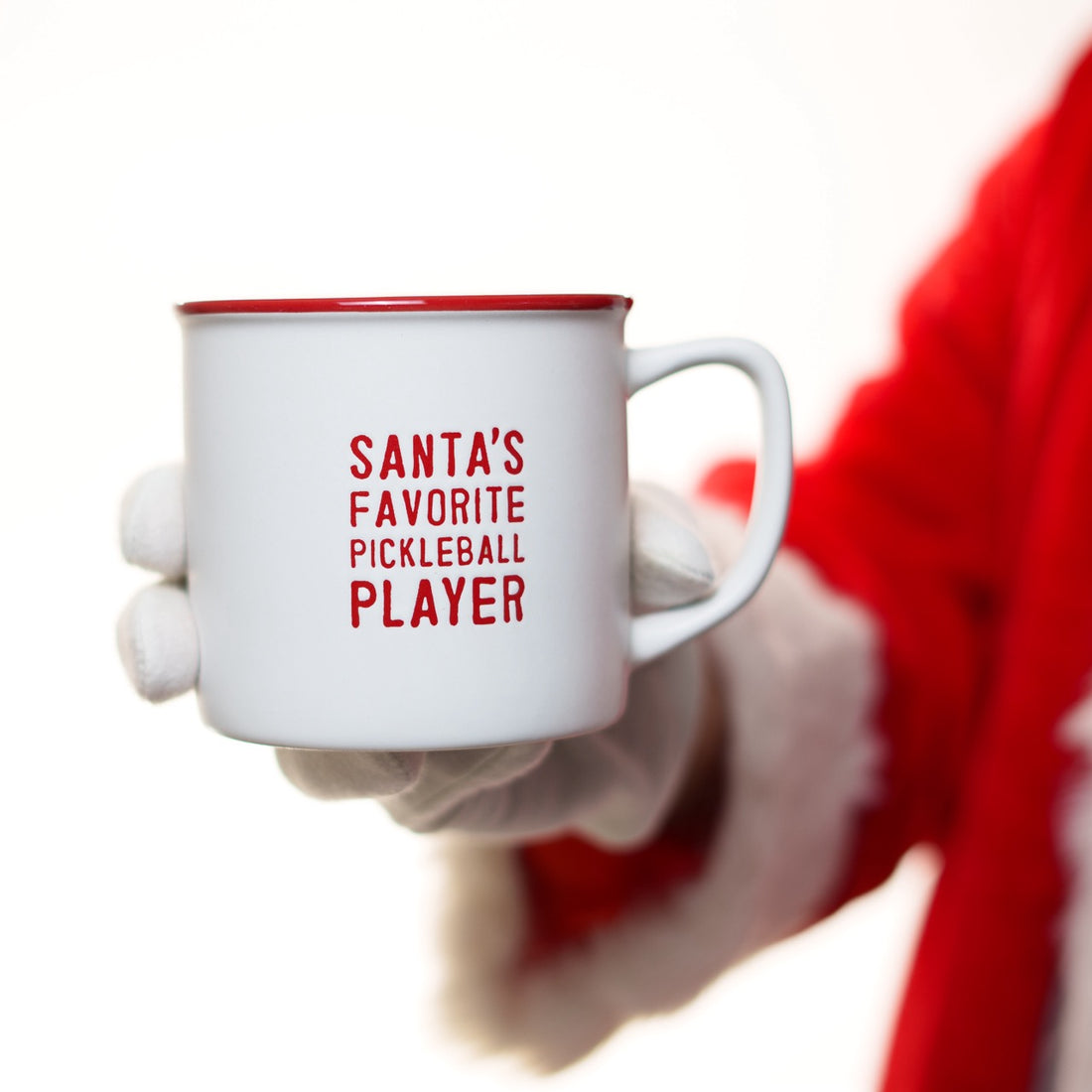 Santa holding a red and white ceramic coffee mug that says Santa&