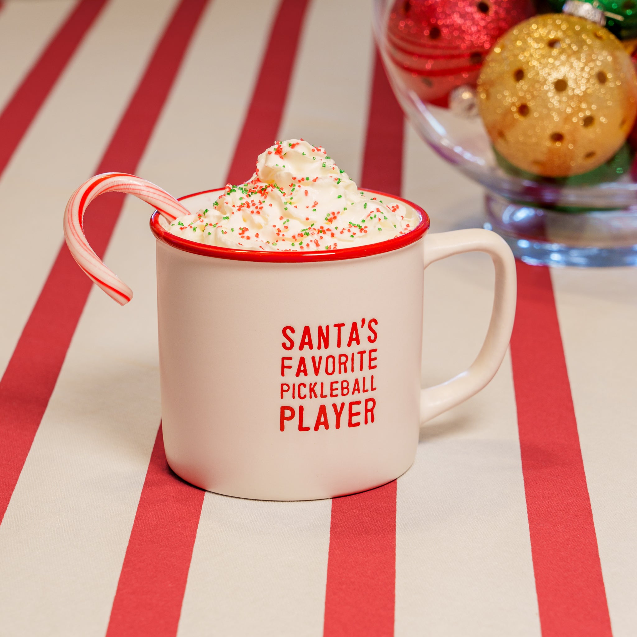 A white debossed mug that says &quot;SANTA&