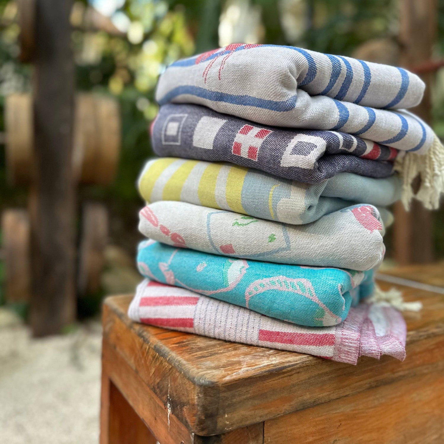 Stack of Turkish beach towels on a table