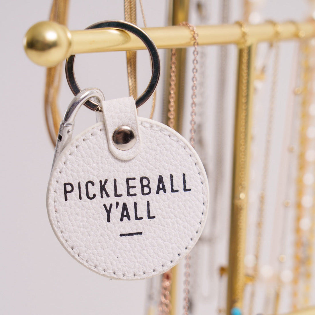 White keychain that says Pickleball Y&